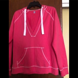 Hoodie - Coral color with white stitching.